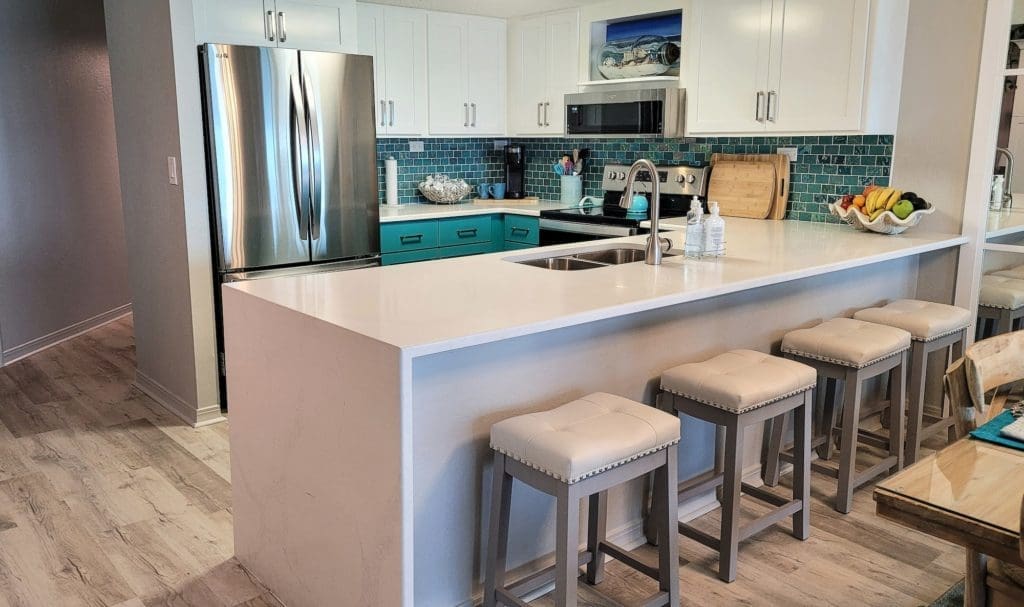 Interior view of Kitchen and dining room in recently remodeled vacation home at beach very open.